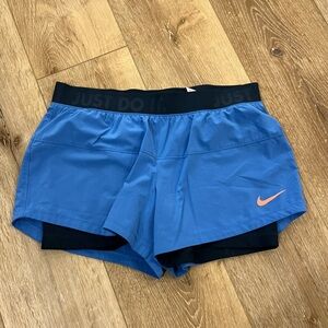 Nike Women's Blue and Black Athletic Shorts